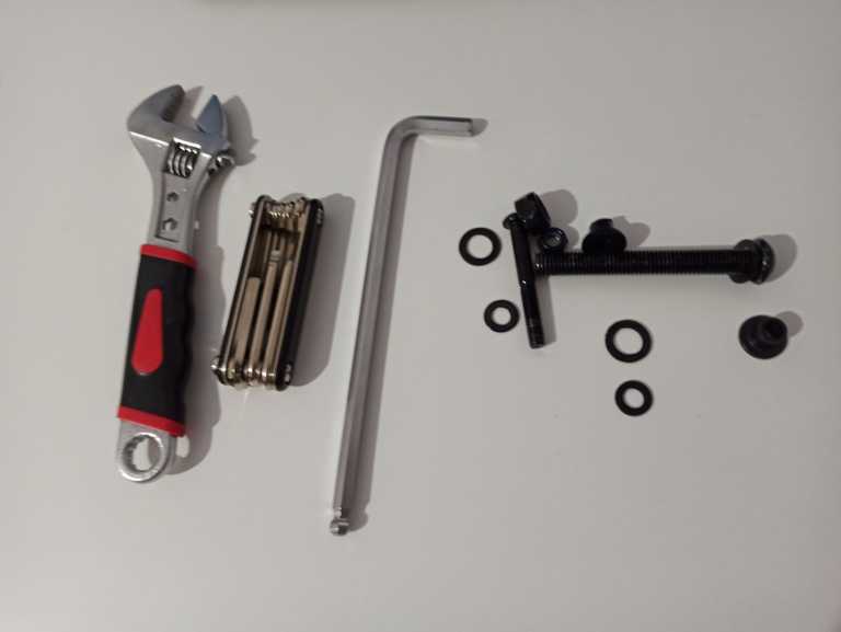 Tools needed for disassembling the stand and screws and nuts